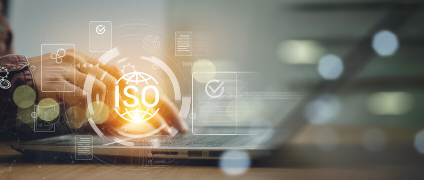 ISO standards quality control, assurance and warranty business technology concept. Businessman using laptop computer with quality assurance and document icon for ISO, ISO concept.