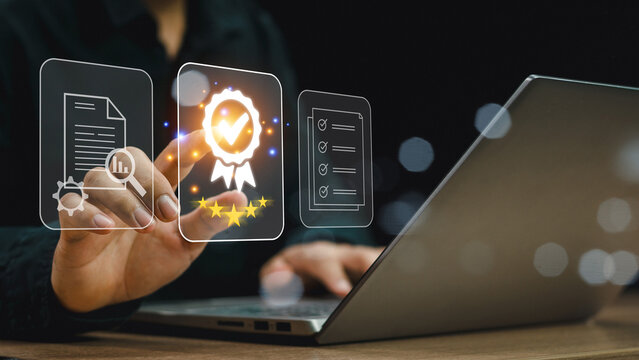 ISO standards quality control, assurance and warranty business technology concept. Businessman using laptop computer with quality assurance and document icon for ISO, ISO concept.