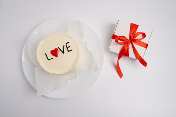 Bento cake with the words "Love and Hearts". A cute dessert gift for any occasion for a loved one. Congratulations card. Love and sweets concept