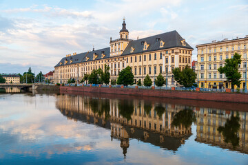 On a peaceful and lightly cloudy summer evening like this the old (1702) University of Wrocław, Poland, reflects beautifully in the Oder River.
