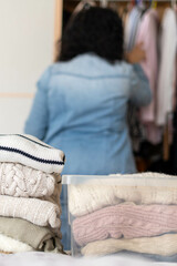 Pile of winter clothes. Concept change of season