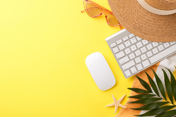 Stylish remote work concept with keyboard setup and summer holiday accessories, on a bright yellow backdrop, crafted to appeal to digital nomads and remote workers looking for a creative workspace - obrazy, fototapety, plakaty