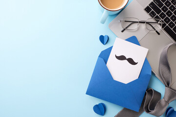 Modern workspace setup featuring a coffee cup, glasses, and a Father's Day card with a mustache...