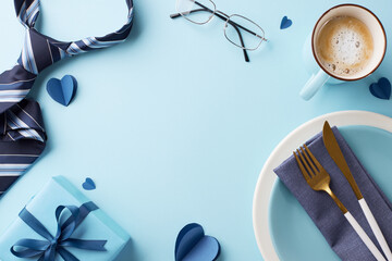 Celebrate Father's Day with this elegantly arranged breakfast table featuring a blue theme, complete with a coffee cup, tie, and gift, leaving space for your personal message to dad