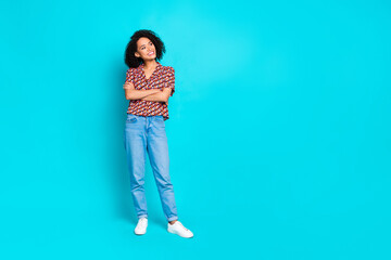 Photo of attractive girl crossing hands look empty space isolated cyan color background