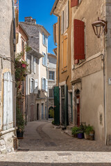 Sauve, France - 04 16 2024: Panoramic View of typical coloful Occitan building facade in a street of the Village on the hill .
