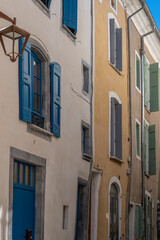 Fototapeta premium Sauve, France - 04 16 2024: Panoramic View of typical coloful Occitan building facade of the Village on the hill .