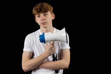 A teenage male holding a megaphone