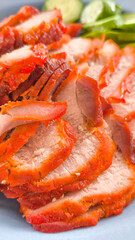 Red pork on rice in a blue plate