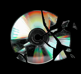 Shattered cd isolated on black background