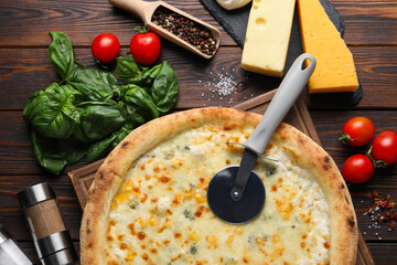 Flat lay composition with delicious cheese pizza and ingredients on wooden table