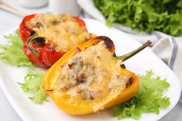 Delicious stuffed peppers on white table, closeup