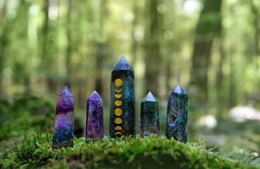 Crystal quartz towers in forest, natural background. Minerals for healing magic Crystal Ritual....