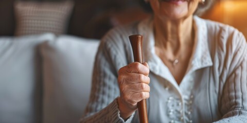 Senior woman with cane at nursing home. Old woman with walking help relaxes at a hospital with crutch at assisted living home.