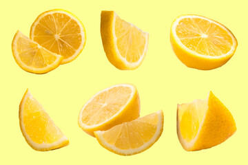 Set of fresh whole and cut Lemon and slices isolated on Yellow background. From top view.