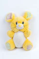 Pluche toy mouse on a white background.
