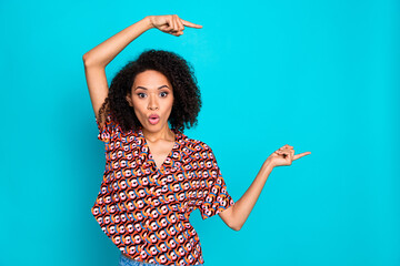 Photo of charming impressed lady wear print shirt showing fingers empty space isolated blue color background
