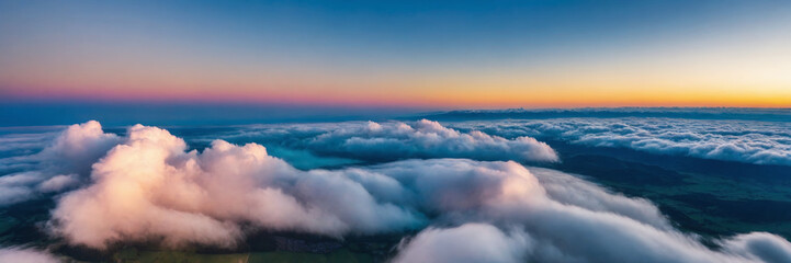 Aerial view of beautiful cloudscape at sunrise. Panoramic image