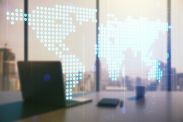 Abstract creative world map and modern desktop with computer on background, international trading concept. Multiexposure
