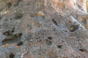 close up of faux volcanic lava rock with holes