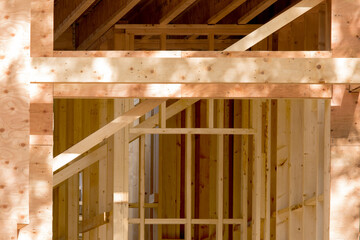 a wall of frame construction house showing wall studs and sheathing with bracing - obrazy, fototapety, plakaty