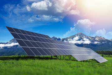 Solar panels of a power plant against a background of beautiful nature.