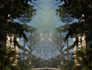 Gotas d´água com céu azul, árvore e prédio. 