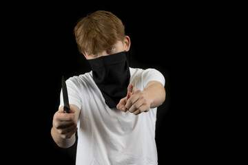 A Teenage Mugger holding a knife