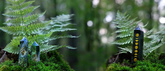 Crystals quartz towers on moss in forest, natural background. Minerals for healing magic Crystal...