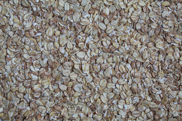 Background texture of rolled oats, flat lay or top view
