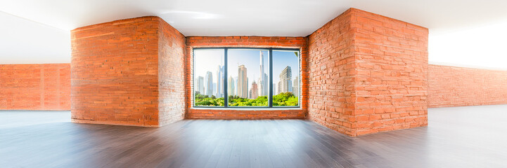 cityscape by window with brick frame and skyscrapers building towers and garden trees in the view