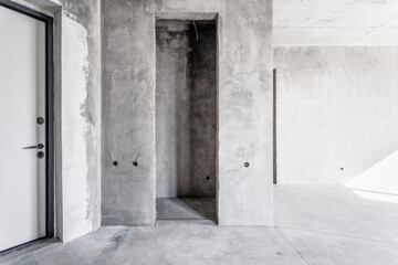 interior of the apartment without decoration in gray colors. rough finish
