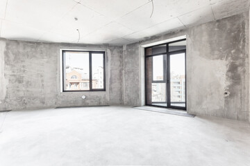 interior of the apartment without decoration in gray colors. rough finish