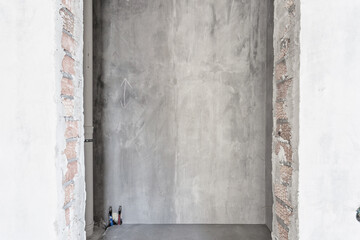 interior of the apartment without decoration in gray colors. rough finish