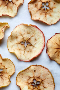 Close-up of baked apple slices on white background