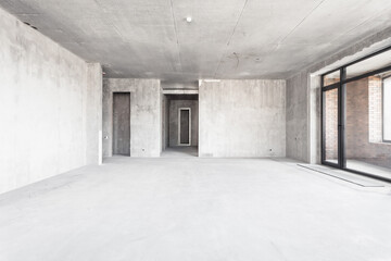 interior of the apartment without decoration in gray colors. rough finish