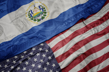 Obraz premium waving colorful flag of united states of america and national flag of el salvador.