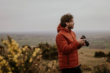 Photographer holding camera, nature photography