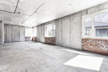 interior of the apartment without decoration in gray colors. rough finish