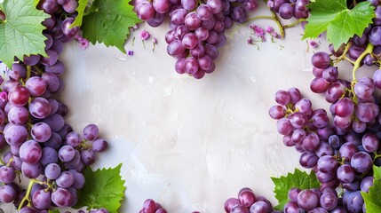 Purple grape clusters on a beige textured background with green leaves and small flowers.