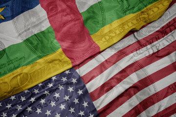 waving colorful flag of united states of america and national flag of central african republic on...
