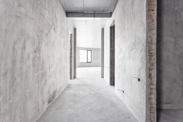 Fototapeta na wymiar interior of the apartment without decoration in gray colors. rough finish