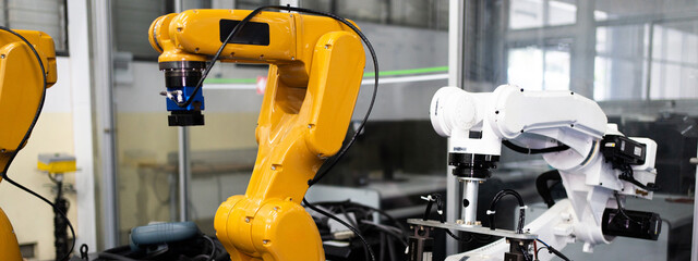 Automated Manufacturing Facility, Industrial robot works automatically in smart autonomous factory. Robot Arm at Production Line at Modern Bright Factory. Concept of electronic, technology, innovation