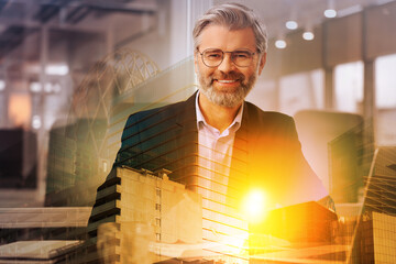 Double exposure of successful businessman and cityscape
