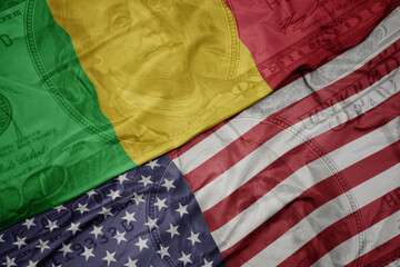 waving colorful flag of united states of america and national flag of mali on the dollar money...