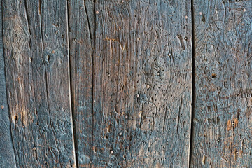 Vintage Charm: Very Old Wooden Wall with Distinctive Texture and Signs of Age