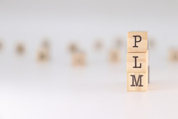 PLM acronym. Concept of Product Lifecycle Management written on wooden cubes isolated on white backgrond