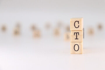 CTO acronym. Concept of chief technology officer written on wooden cubes isolated on white background.