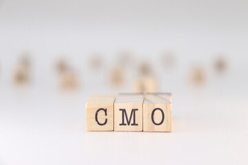 CMO acronym. Concept of Chief Marketing Officer written on wooden cubes isolated on white background