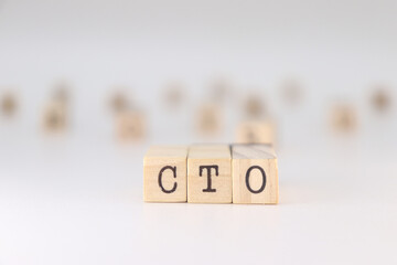 CTO acronym. Concept of chief technology officer written on wooden cubes isolated on white background.